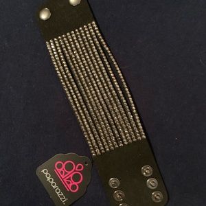 Never worn, black, simulated rhinestone studded leather snap bracelet